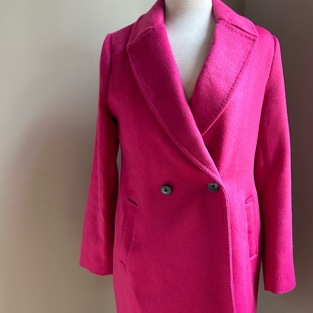 Woman's pink Rachel Zoe coat.